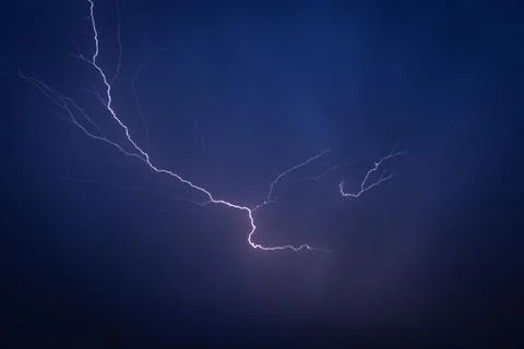 Lightning in a summer thunderstorm Stock Photos