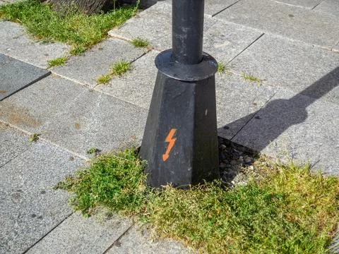 Lightning symbol on the base of a pole. Be careful of electricity. The pole.. Stock Photos