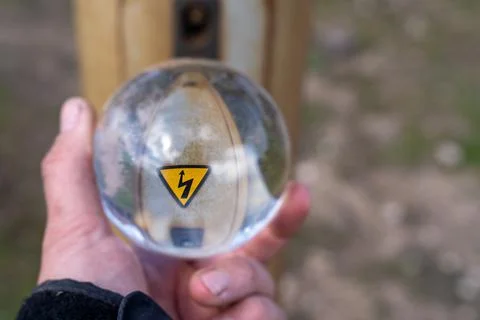 The lightning symbol lightning on a yellow triangular background is visible t Stock Photos