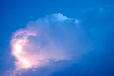 Lightnings in storm clouds. Peals of a thunder and the sparkling lightnings.. Stock Photos