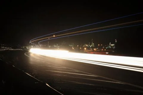 Lightrails in a highway Stock Photos