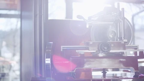 Lightreflection on a red cutting machine Stockbeeldmateriaal 119222489