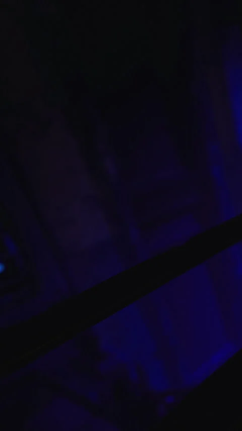 Lights and shadows create a unique pattern in a dimly lit place Stock Footage 331746592