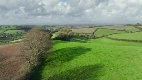 Lights and Shadows over Fields and Farms from a drone, Devon, England, UK Vidéo 254560272