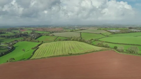 Lights and Shadows over Fields and Farms from a drone, Devon, England, UK Vidéo 254560335