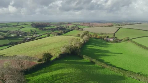 Lights and Shadows over Fields and Farms from a drone, Devon, England, UK Vidéo 254560395