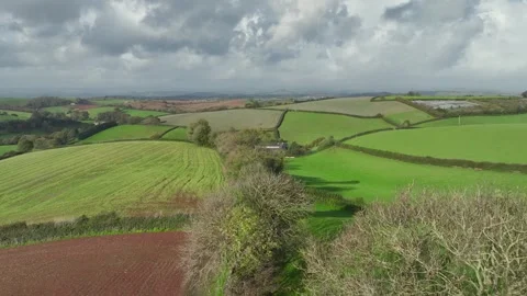 Lights and Shadows over Fields and Farms from a drone, Devon, England, UK Vidéo 254560436