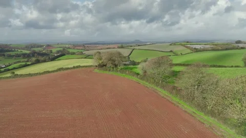 Lights and Shadows over Fields and Farms from a drone, Devon, England, UK Vidéo 254560473