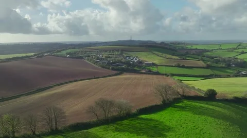Lights and Shadows over Fields and Farms from a drone, Devon, England, UK Vídeos de archivo 254560525