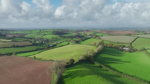 Lights and Shadows over Fields and Farms from a drone, Devon, England, UK Vidéo 254560598