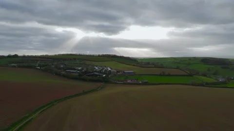 Lights and Shadows over Fields and Farms from a drone, Devon, England, Europe 動画素材 261043415
