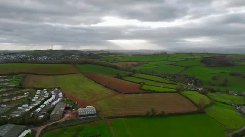 Lights and Shadows over Fields and Farms from a drone, Devon, England, Europe 動画素材 261043474