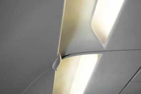 Lights and water diffusers in plane cockpit over the passengers seats Stock-Fotos