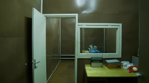 Lights Are Turned On in the Interrogation Room of an Underground Secret Bunker. Video stock 293745397