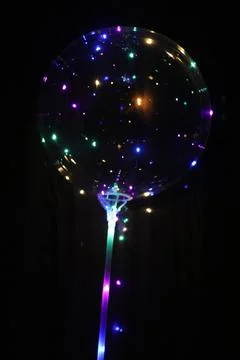 Lights balloon with black background Stock Photos
