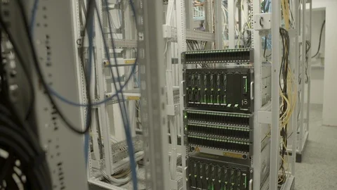 Lights blinking on cloud computing system in rack at illuminated server room - Stock Footage 129211731