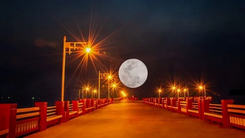 The lights on the bridge and Craters On The Surface Of The full moon Stock Footage 130096793