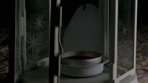 Lights a candle lamp Stock Footage 90247327