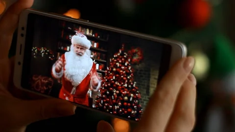Lights on the Christmas tree. Blurred background. Woman looking Santa Claus Stock Footage 121259855