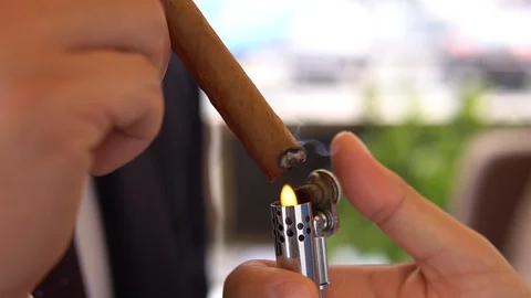 Lights a cigar Stock Footage 102380630