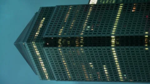 Lights coming on Canary Wharf Building 1 Canada square London Stock Footage 8825341