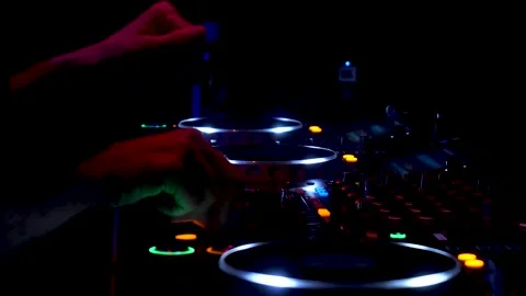 Lights from a dj's table while playing music in a nightclub 库存影片 168358819
