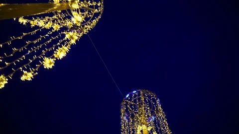 The lights of festive garlands on the streets of the city. New Year theme Stock Footage 100990153