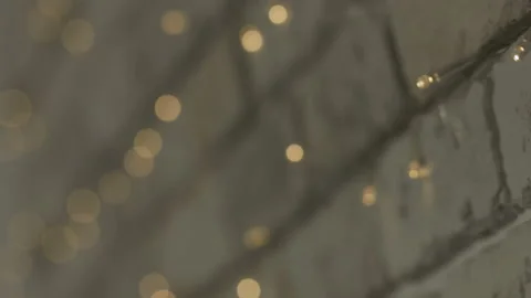 The lights of the garland lighting up and going out in the wall Stockbeeldmateriaal 106957219