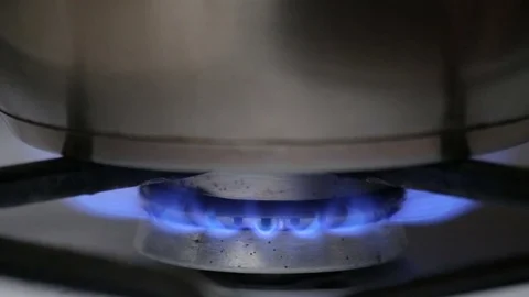 Lights up the gas under the pots. Close up Stock Footage 75832683