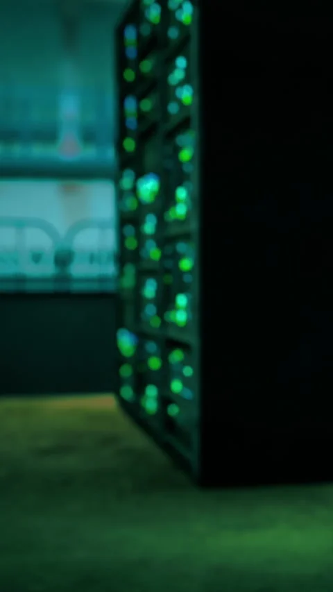 Lights glow from server equipment in a data center during nighttime hours Stock Footage 337958448