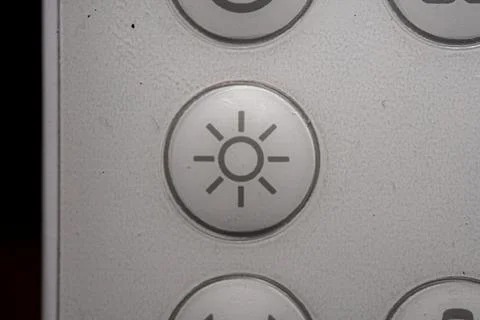 Lights icon and button close up of an air conditioner remote controller Stock Photos