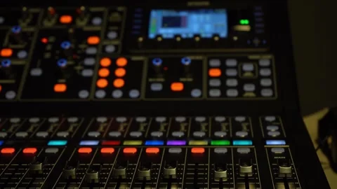 Lights knobs and sliders on an audio sound board 스톡 동영상 330479948