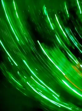Lights moving in circular green pattern. Motion radial bokeh for Christmas gr Stock Photos
