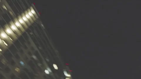 Lights of multi-storey buildings rotate at night 库存影片 284236108