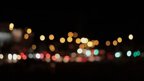 Lights of the night city background. Defocus headlights of moving cars urban Stock Footage 115591131