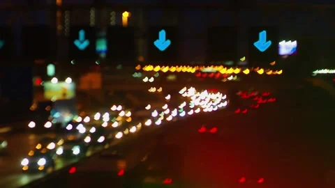 Lights of the night city background. Defocus headlights of moving cars urban Stock Footage 131432961