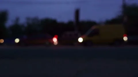 Lights of night city background. Defocus headlights moving cars urban traffic. Vidéo 155014311