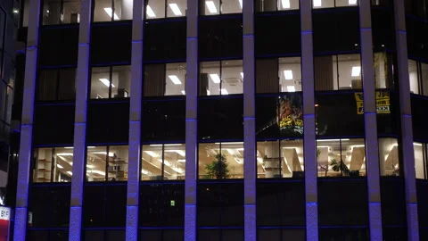Lights on in office building at night. View from exterior. Shibuya.Tokyo, Japan Stock Footage 248685774