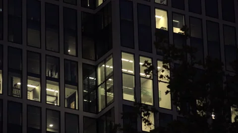 Lights on in office building windows at night 4k 库存影片 55881706