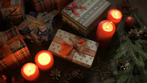Lights out candles on a table decorated with Christmas decorations. Stock Footage 144936461