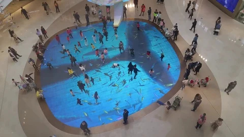 Lights phantom created fish pond with fish shuttle, children in the happy play Vídeos de archivo 123324185