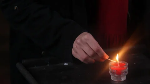 Lights A Red Candle Stock Footage 37739210