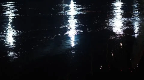Lights reflect on the water surface in night. River fast stream. Stock Footage 49908132