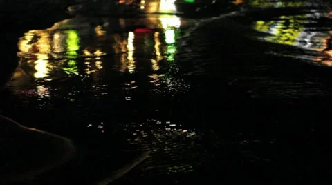Lights Reflected off Waves Washing on the Sand at Night Stock Footage 8599169