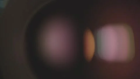 Lights reflecting in the camera lens glass. Stock Footage 284043149
