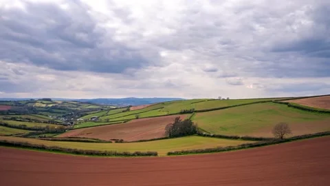 Lights, Shadows and Clouds in HYPERLAPSE over Devon fields, English Village 動画素材 175767666