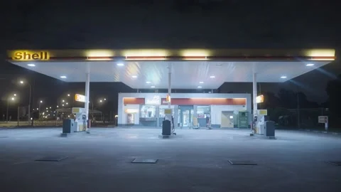 Lights at Shell fuel station at night Stock Footage