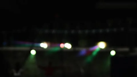 The lights of the stage flicker in the distance. Blur Stock Footage 316040186