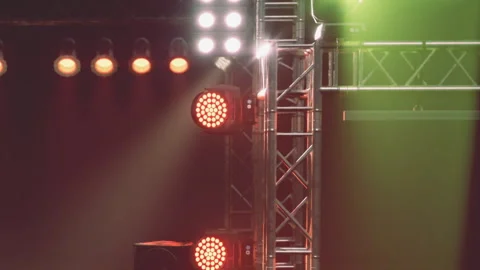 Lights on a stage at a music event in the evening with a dark background Stock Footage 344314499