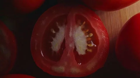 The lights streaked through the tomato on the table background in the dark room. Stock Footage 145139640